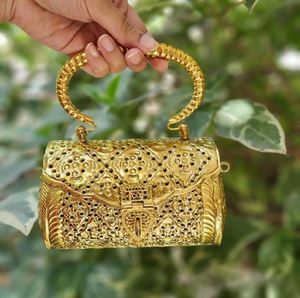 A trio of dual-tone gold and <b>silver</b> brass hand <b>clutches</b> featuring varied textured weaves, floral relief carvings, and top handle - Product Image 3
