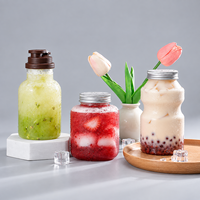 Bouteille de boisson en PET transparente de 500 ml de qualité alimentaire avec bouchon à vis en aluminium personnalisé pour l'emballage de thé au lait, de jus et de soda