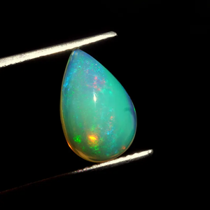 พลอยโอปอลไฟสีขาวธรรมชาติ HAYAAT GEMS รูปทรงลูกแพร์เจียระไนแบบคาโบชอง น้ำหนัก 1.50 กะรัต พร้อมสีสันเปลี่ยนแปลง - Product Image 5