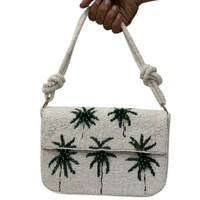 Pochette d'épaule artisanale perlée ivoire avec broderie palmier et motifs, fermeture éclair, bandoulière unique, sac de villégiature OEM personnalisable