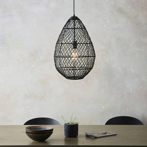Black, teardrop-shaped lampshade woven from natural rattan, a decorative pendant lamp for home interiors, - Product Image 2