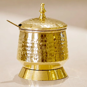 Solid brass ghee <b>pot</b> boasting a distinct brushed metal texture and a matching slotted spoon. Available at wholesale price. - Product Image 3