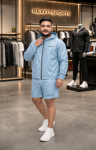 ชุดเซ็ตเสื้อผ้ากีฬา REXFIT SPORTS ผ้าไนลอนสีฟ้าอ่อนสำหรับผู้ชาย เสื้อแจ็คเก็ตกันลมน้ำหนักเบา กางเกงขาสั้น ชุดกีฬาแนวสตรีทแวร์ - Product Image 4