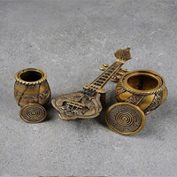 Beautiful miniature brass musical instrument set featuring an elegant sitar and small holy pots, available at wholesale prices.