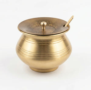 Timeless brass ghee <b>pot</b> accented by an intricate floral border engraving and a matching spoon. Available at wholesale price. - Product Image 3