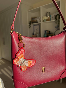 Breloque de sac papillon perlée à la main avec broderie de sequins, accessoire pour fans de sport, par MULTI CRAFT - Product Image 3