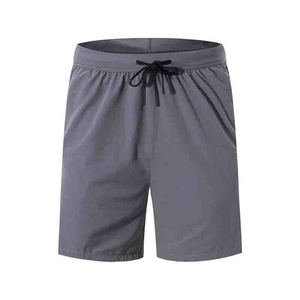Pantaloncini da uomo leggeri per palestra e corsa, con logo frontale, ad asciugatura rapida, traspiranti, in Spandex/Poliestere, con coulisse in vita e tasca con cerniera - Product Image 2