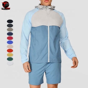 Conjunto Deportivo de Dos Piezas para Hombre, con Capucha y Bloques de Color, Chaqueta Cortavientos Ligera de Poliéster y Pantalones Cortos, con Logotipo Personalizado - Product Image 1