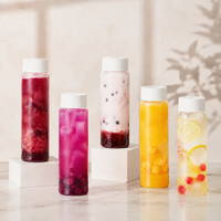 Vente en gros de bouteilles en plastique PET de forme cylindrique longue pour jus, whisky, avec bouchon à vis en PP, qualité alimentaire, logo personnalisé, bouteille en plastique