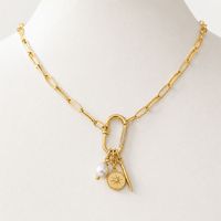 Collier mousqueton doré avec fermoir pavé de zircons et pendentif étoile polaire pour marques de bijoux de boutique en gros