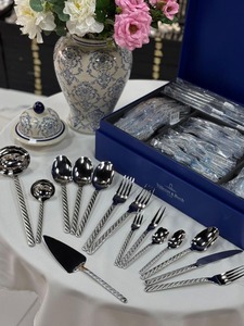 Luxury <b>silver</b> stainless steel flatware set featuring embossed <b>ornate</b> scroll handles and <b>mirror</b> polished heads displayed - Product Image 3