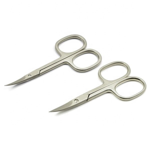 Tijeras de maquillaje de nivel experto diseñadas para dar forma a las cejas con precisión y cuidado delicado del vello facial con cuchillas ultrafinas. - Product Image 1