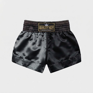Shorts de Muay Thai personnalisés en satin noir et orange, à fente haute, uniforme de combat de kickboxing, short de boxe en gros - Product Image 6