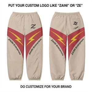 Pantalon coupe-vent réversible en coton 100% 130 GSM de qualité supérieure, design à panneaux beige, rouge et jaune, impression de logo personnalisée - Product Image 1
