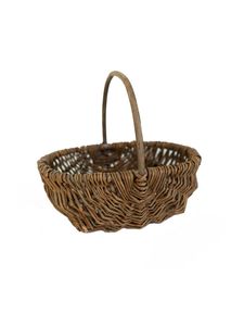 Cesta de ratán extra grande tejida a mano con asas para guardar ropa sucia, juguetes o artículos del hogar en un entorno de estilo rústico. - Product Image 5