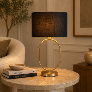 Lampe de table Orbit Loop en métal avec cadre ovale, abat-jour en lin noir, finition or brossé, lumière ambiante chaude, décoration élégante - Product Image 1