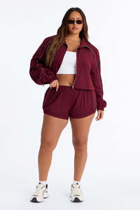 Wholesale Women’s Burgundy Two Piece Windbreaker Set with Full <b>Zip</b> Athletic Jacket and Matching High Waist <b>Shorts</b> Reflective Set - Product Image 6
