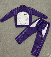 Ensemble de survêtement unisexe du fabricant : veste zippée et pantalon, coupe-vent réfléchissant à blocs de couleur personnalisés en polyester et nylon