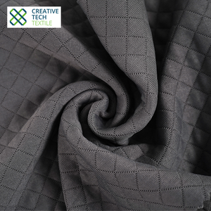 Solución textil sostenible RCO-TK0007 Tejido con mejora de textura Seawool PET/Lyocell=52/42/6 Jacquard Diamond para ropa de viaje - Product Image 2