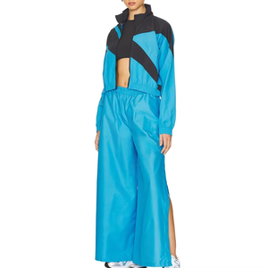 Survêtement coupe-vent en nylon pour femme, veste color block et pantalon large détachable, usine de vêtements de sport OEM ODM - Product Image 1