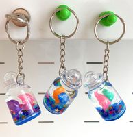 Llavero de botella de acrílico líquido Tema de parque marino flotante Patrón de delfín 3D