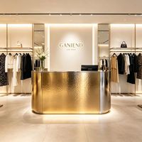 Comptoir de bar haut de gamme en acier inoxydable martelé effet eau et ondulations pour magasin de vêtements et salon