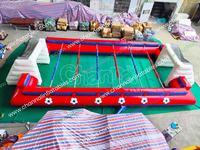 Structure gonflable d'extérieur multifonctionnelle avec terrain de baby-foot, piste de glisse, aire de jeux et château de saut, idéale pour événements sportifs, décorations, foires et marchés de carnaval