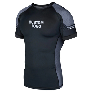 เสื้อแรชการ์ดแขนสั้นคุณภาพสูง ทนทาน น้ำหนักเบา รุ่นใหม่ล่าสุด แห้งเร็ว เป็นมิตรกับสิ่งแวดล้อม ผลิตจากผ้าสแปนเด็กซ์และโพลีเอสเตอร์ สำหรับกีฬา FIGHT CAGE ปี 2026 - Product Image 1