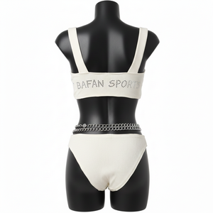 Conjunto de bikini premium para mujer, de nailon y spandex acanalado, color blanco, elástico, con pedrería y logotipo personalizado por transferencia térmica. - Product Image 2