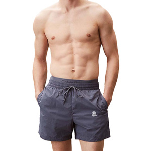 Calvin Klein - Shorts de Baño para Hombre, Color Azul Marino, 100% Poliéster, Secado Rápido, con Cordón Ajustable, Bolsillos y Logotipo Frontal - Product Image 1