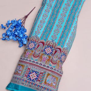 Tela Crepé Ligera de 54 Pulgadas con Patrón Paisley, Color Turquesa Sublime, Adornada con Lentejuelas Deslumbrantes, Diseño de Elefante y Pavo Real - Product Image 1
