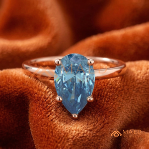 Bague de fiançailles unique en or rose plaqué or rose, sertie d'un moissanite bleu en forme de poire, bijoux de mariée en or rose - Product Image 1