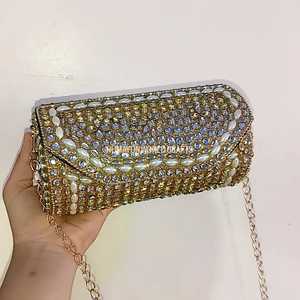 Elegant <b>gold</b> kundan work <b>clutch</b> with pearls and crystals, handcrafted for weddings, parties, and festive occasions. - Product Image 2