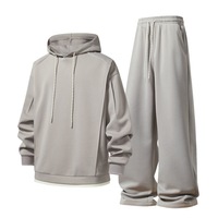 Prix d'usine – Ensemble décontracté deux pièces pour homme avec logo personnalisé, comprenant un sweat à capuche à manches longues et un pantalon, idéal pour le sport urbain et les loisirs d'été.