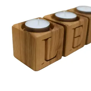 Muestra Portavelas de madera de acacia y soporte Portavelas de madera Soporte de pilar de vela proveedor mayorista al precio más bajo