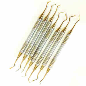 Juego de 7 piezas de Dique de Goma Endodóntico, Espátula Manual para Relleno de Resina, Cabeza de Titanio Chapada en Oro, Acero Inoxidable Grado A+, Certificado CE - Product Image 1