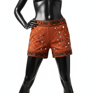 Shorts pour femmes en tissu polyester et élasthanne hautement extensible, toucher doux, couleur rouille, logo en cristal thermocollé. - Product Image 6