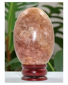 Venta al por mayor de piedra lunar de melocotón natural Shiva Lingam con soporte de oro, adorno de piedra ovalada, decoración para el hogar, coleccionable - Product Image 1