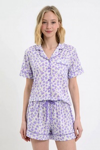 Womens blue star print pajama set with short sleeve button up top and drawstring pants in studio for cute comfortable sleepwear - Product Image 5