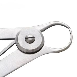 Cet outil, un calibre de couronne dentaire Iwanson, est utilisé pour des mesures précises en dentisterie et en laboratoire. - Product Image 6