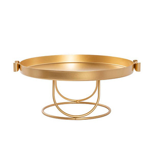 Elegant Gold <b>Cake</b> <b>Stand</b> Featuring A Shallow Round Tray With Raised Edges Side Handles & A Unique Geometric Wire Base For Serving - Product Image 1