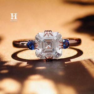 แหวนหมั้นเพชรทรงแอสเชอร์คัท 14K ทองคำขาวสั่งทำพิเศษ ประดับเพชรสเต็ปคัทและพลอยไพลินสีน้ำเงินด้านข้าง - Product Image 1