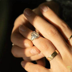 Elegant <b>Emerald</b> Cut Lab Grown Diamond <b>Ring</b> With Tapered Side Stones And Luxurious Gold Band Design - Product Image 4