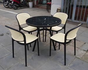 Silla de Bistró Moderna Obsidian de Imitación de Ratán y Cuero |   Asiento Trasero Redondeado de Polipropileno para Todo Clima, Premium para Hogar, Yate y Patio - Product Image 1
