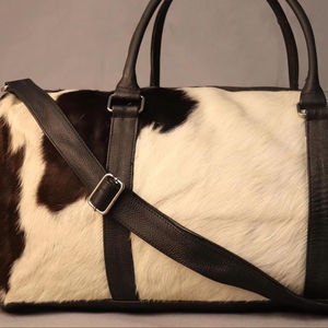 กระเป๋าเดินทางหนังวัวแท้แบบมีซิป  กระเป๋าสะพายข้างสำหรับเดินทางช่วงสุดสัปดาห์ สไตล์วินเทจ น้ำหนักเบา ความจุเยอะ เหมาะสำหรับทุกเพศ - Product Image 1