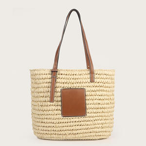 Complementa tus atuendos para el clima soleado con este encantador bolso de hilo natural con forma estructurada y detalles de cuero hoy. - Product Image 1