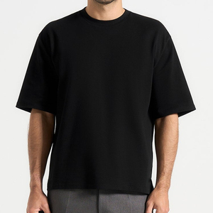 T-shirt en jersey de coton noir surdimensionné pour homme, manches courtes, col rond, décontracté, couleur unie, tricoté, coupe ajustée - Product Image 1