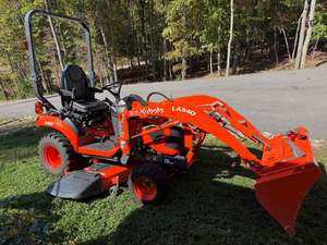 Tracteur agricole d'occasion Kubota BX23S 4x4 mini 20 CV avec pompe automatique et roues motrices - Product Image 1