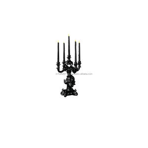 Candelabro de hierro con brazos detallados y acabado envejecido para mejorar el estado de ánimo de dramas históricos o escenarios de teatro - Product Image 1