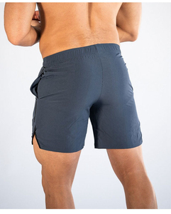 Shorts de sport pour hommes en polyester et élasthanne, bleu marine uni, taille mi-haute, élastique, séchage rapide, avec bande latérale tricotée - Product Image 2